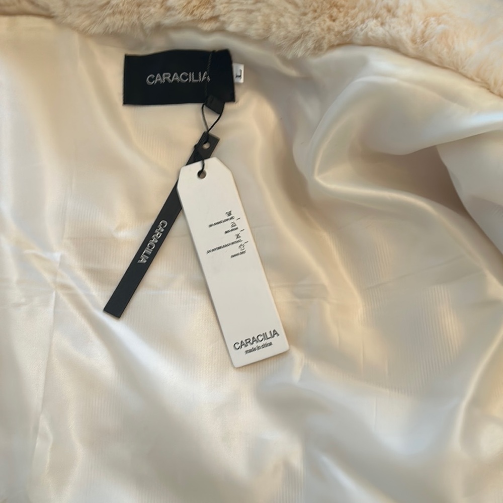 An elegant fur shrug/stole to wear with your gowns or cocktail dresses.